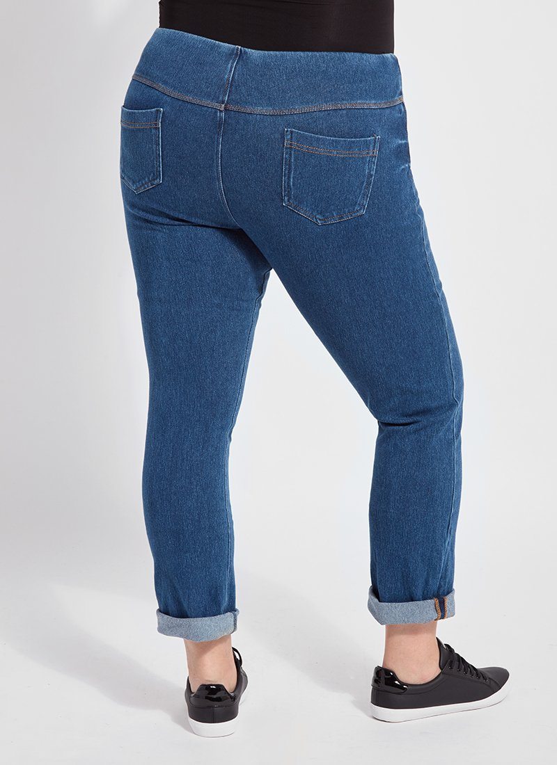 color=Mid Wash, back view, plus size boyfriend cut denim leggings with comfort waistband to smooth and slim