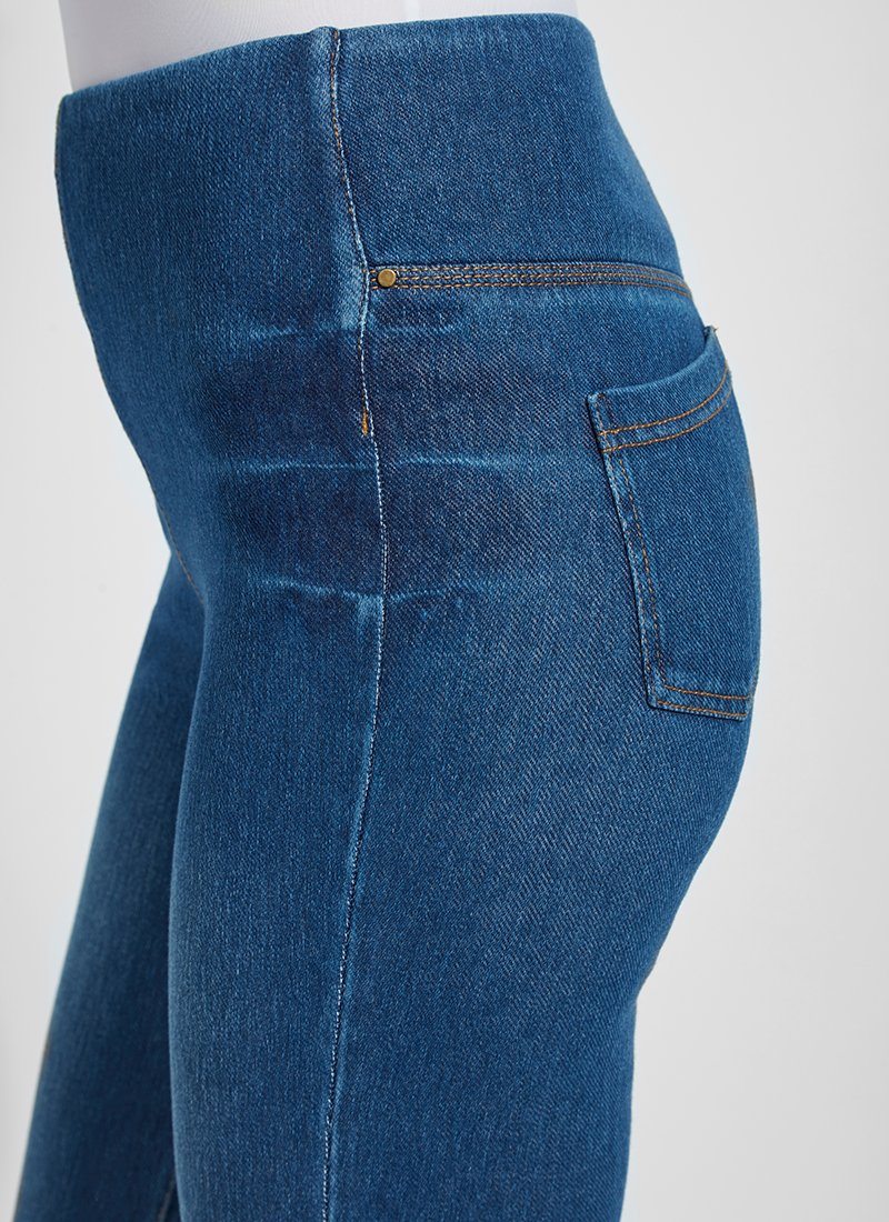 color=Mid Wash, waist detail, plus size boyfriend cut denim leggings with comfort waistband to smooth and slim