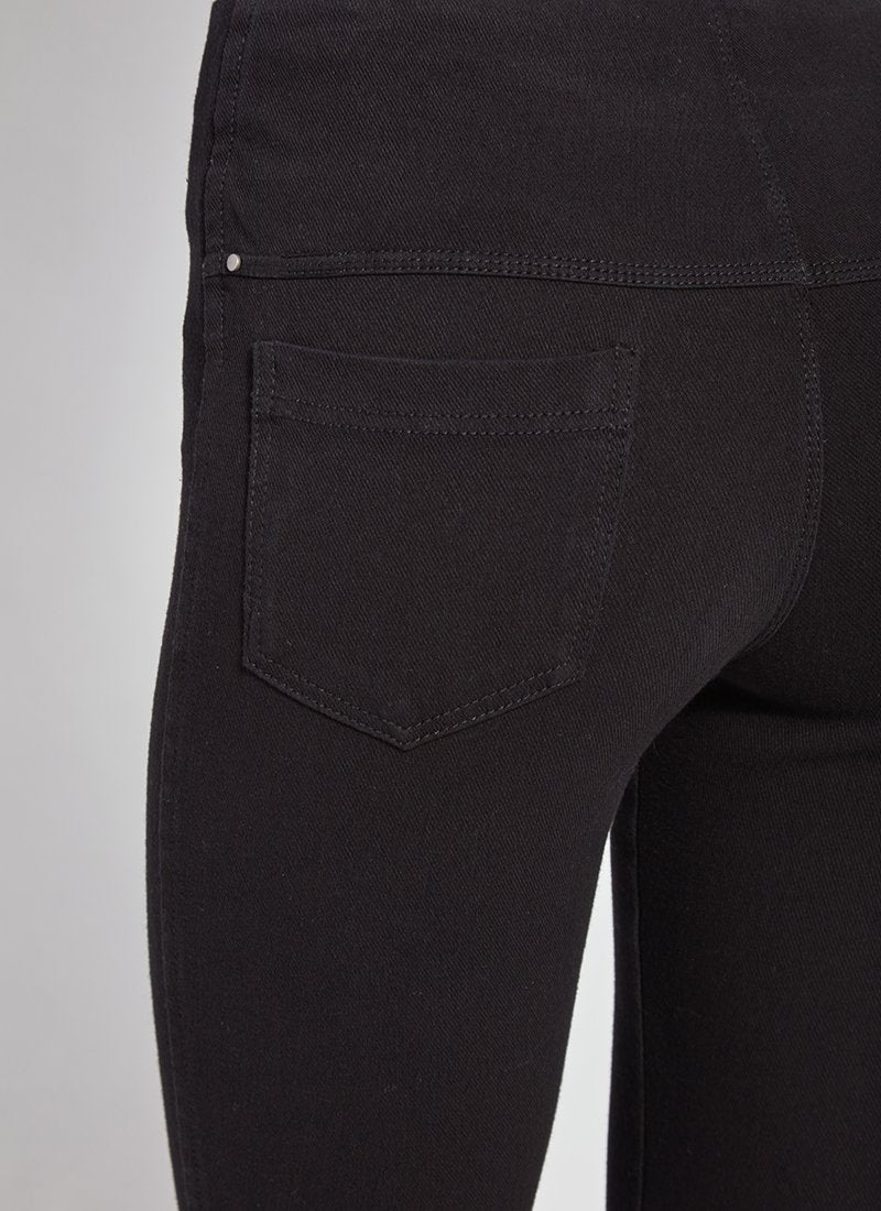 color=Black, Rear detail view of black toothpick denim jean leggings with patented concealed waistband