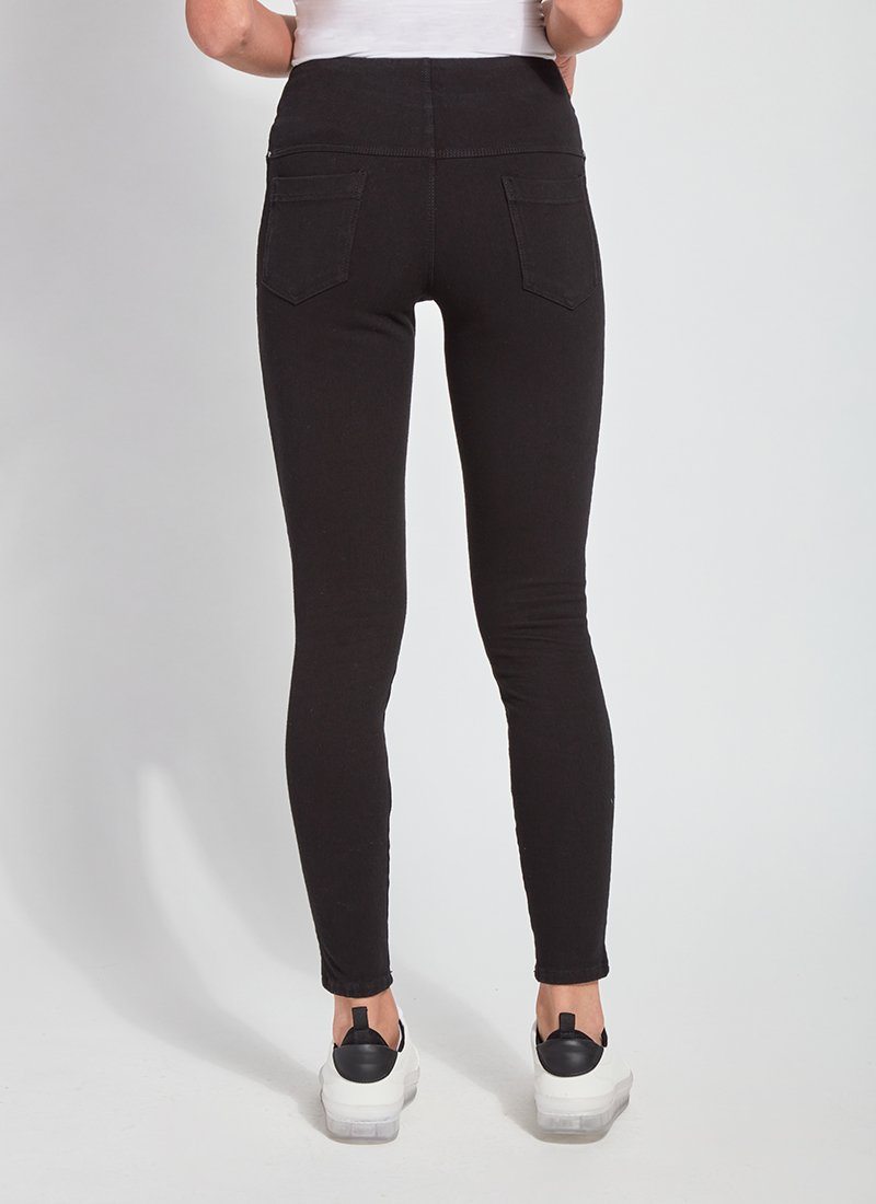 color=Black, Rear view of black toothpick denim jean leggings with patented concealed waistband, seen from waist down