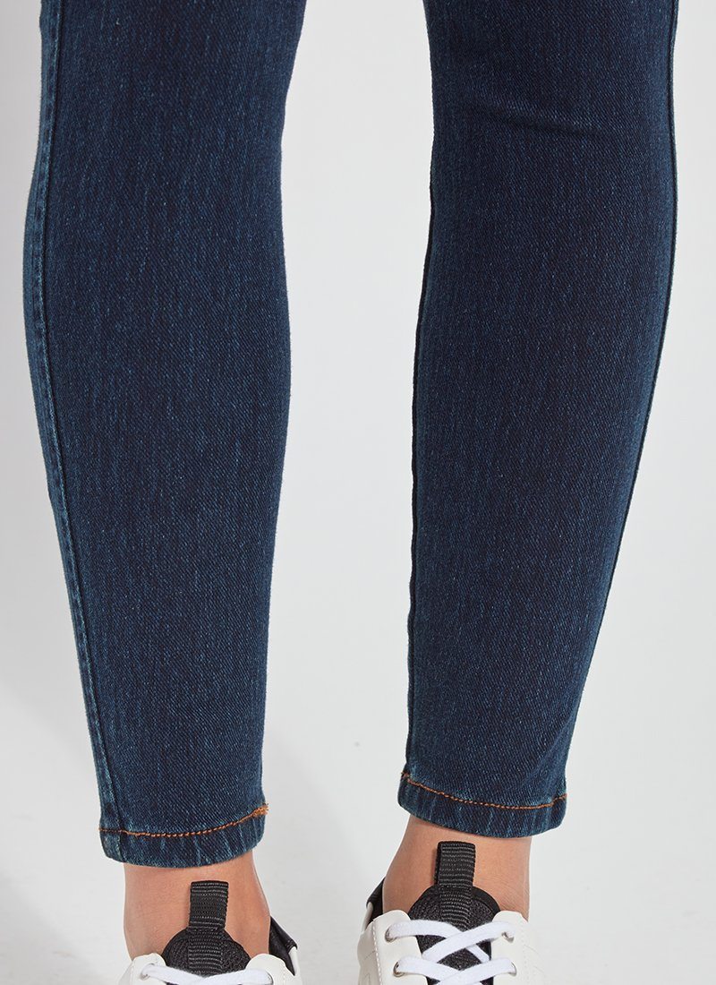 color=Indigo, Front detail view of lower legs, indigo color toothpick denim jean leggings with patented concealed waistband