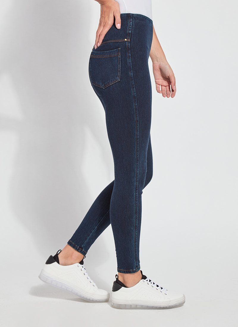 color=Indigo, Side view of indigo toothpick denim jean leggings with patented concealed waistband, seen from waist down