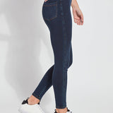 color=Indigo, Side view of indigo toothpick denim jean leggings with patented concealed waistband, seen from waist down