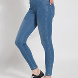 color=Mid Wash, Side view of mid wash blue, toothpick denim jean leggings with patented concealed waistband, seen from waist down