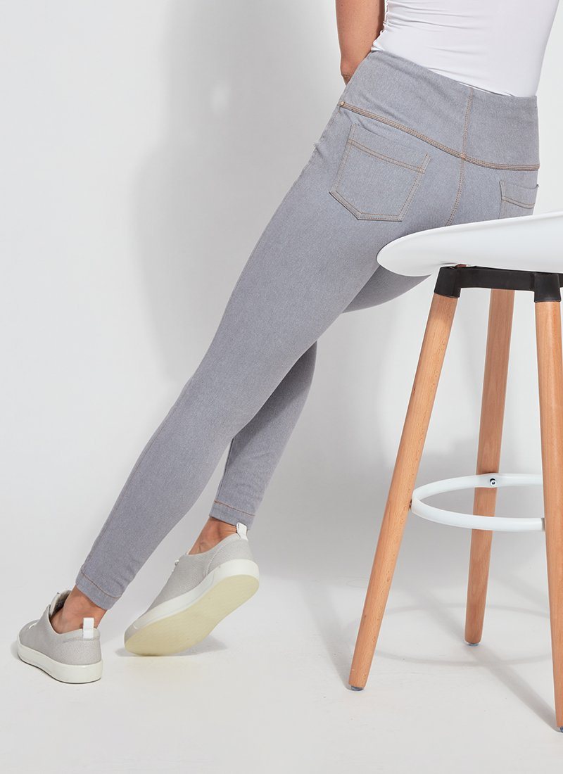 color=Uptown Grey, Seated rear view of uptown gray toothpick denim jean leggings with patented concealed waistband