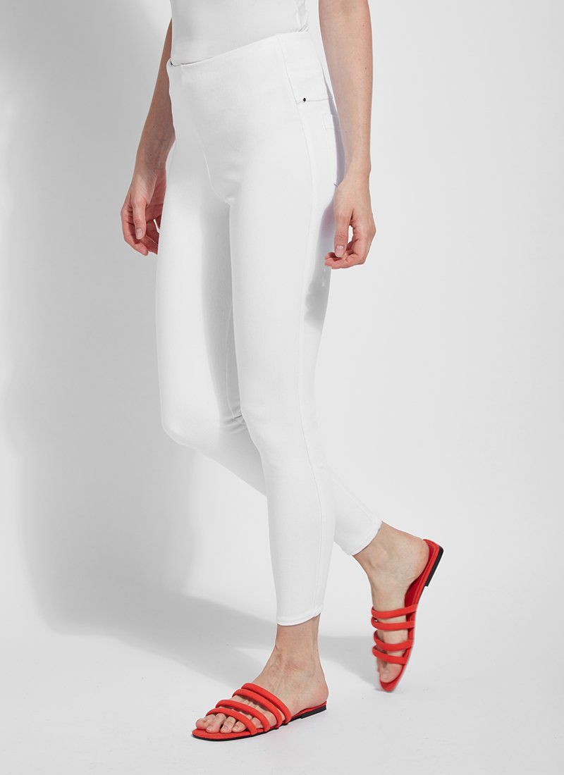 color=White, Angled side view of white toothpick denim jean leggings with patented concealed waistband, seen from waist down