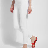 color=White, Angled side view of white toothpick denim jean leggings with patented concealed waistband, seen from waist down