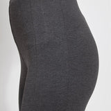 color=Charcoal, Side detail view of charcoal ponte laura legging with patented concealed waistband
