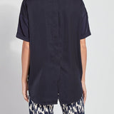 color=True Navy, back view, oversized flowy women’s shirt in stretchy knit jersey, rounded hem and drop shoulder sleeves