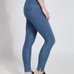 color=Mid Wash, side view of denim skinny jean legging with concealing waistband, seen from waist down