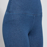 color=Mid Wash, Front, angled detail shot of mid wash blue cotton and spandex leggings with concealed signature waistband