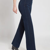 color=Indigo, side view, women's denim pant made from versatile stretch denim, has a concealed slimming waistband