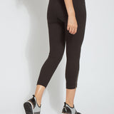 color=Black, back view, cropped denim jean leggings with zipper detail at hem and comfort waistband