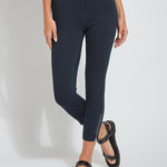 color=Indigo, front view, cropped denim jean leggings with zipper detail at hem and comfort waistband