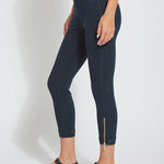 color=Indigo, side view, cropped denim jean leggings with zipper detail at hem and comfort waistband