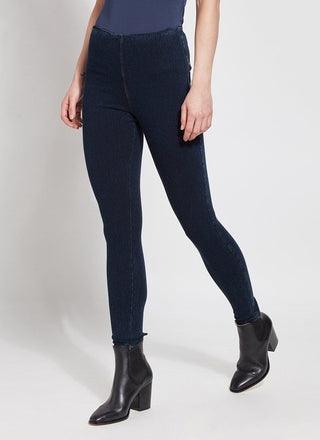 color=Indigo, Angled front view of indigo  toothpick denim jean leggings with patented concealed waistband, seen from waist down