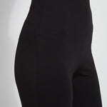 color=Black, waist detail, plus size curvy legging with body-hugging fit to knee, flare opening, side slit, comfort waistband