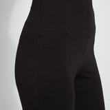 color=Black, waist detail, plus size curvy legging with body-hugging fit to knee, flare opening, side slit, comfort waistband