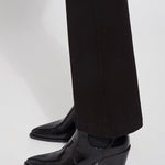 color=Black, hem detail, knit denim jean leggings with deep side pocket, skims hips and thighs and opens into bootcut hem