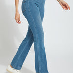 color=Mid Wash, side view, knit denim jean leggings with deep side pocket, skims hips and thighs and opens into bootcut hem