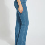 color=Mid Wash, side view, knit denim jean leggings with deep side pocket, skims hips and thighs and opens into bootcut hem