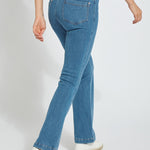 color=Mid Wash, back angle, knit denim jean leggings with deep side pocket, skims hips and thighs and opens into bootcut hem