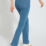 color=Mid Wash, back angle, knit denim jean leggings with deep side pocket, skims hips and thighs and opens into bootcut hem