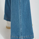 color=Mid Wash, hem detail, knit denim jean leggings with deep side pocket, skims hips and thighs and opens into bootcut hem