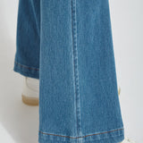 color=Mid Wash, hem detail, knit denim jean leggings with deep side pocket, skims hips and thighs and opens into bootcut hem