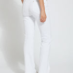 color=White, back view, knit denim jean leggings with deep side pocket, skims hips and thighs and opens into bootcut hem