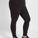 color=Black, angled side view, stretch cotton leggings, yoga pants, with smoothing comfort waistband and lifting, contouring seaming 