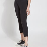 color=Black, Angled front view of black flattering cotton crop leggings with concealed waistband for control and comfort