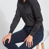 color=Black, seated side view, slim fit women’s button up shirt with curved hem, made with wrinkle resistant microfiber