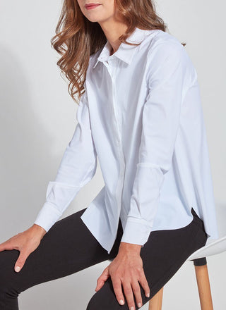 color=White, seated side view, slim fit women’s button up shirt with curved hem, made with wrinkle resistant microfiber