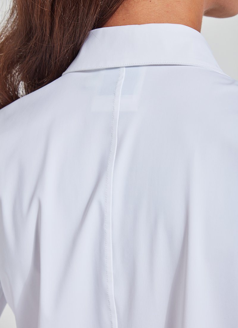 color=White, back neckline detail, slim fit women’s button up shirt with curved hem, made with wrinkle resistant microfiber