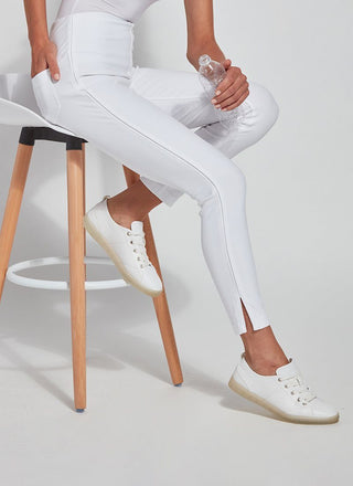 color=White, Seated side view of white Park Jean Legging, in eco-friendly Repreve Knit Denim, with fashion details and slimming 360 control waistband