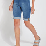 color=Mid Wash, front angle, women's denim jean short, smoothing comfort waistband, body hugging in hips and looser across thigh