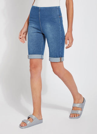 color=Mid Wash, front angle, women's denim jean short, smoothing comfort waistband, body hugging in hips and looser across thigh