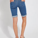 color=Mid Wash, back view, women's denim jean short, smoothing comfort waistband, body hugging in hips and looser across thigh