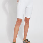 color=White, front view, women's denim jean short, smoothing comfort waistband, body hugging in hips and looser across thigh
