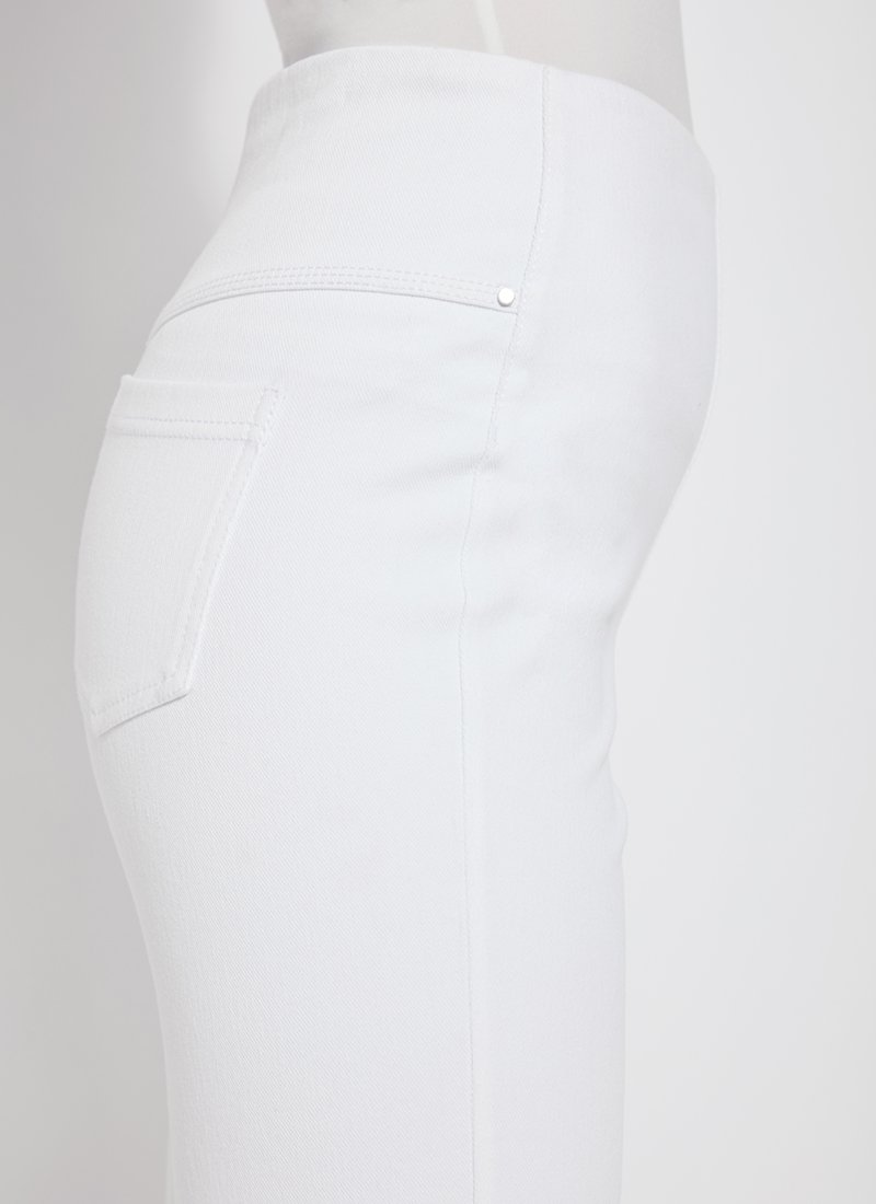 color=White, side view, women's denim jean short, smoothing comfort waistband, body hugging in hips and looser across thigh