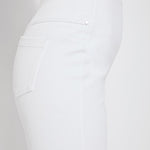 color=White, side view, women's denim jean short, smoothing comfort waistband, body hugging in hips and looser across thigh