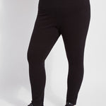 color=Black, front view, plus size denim skinny jean leggings with concealed smoothing waistband for flattering fit