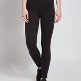 color=Black, front view, plus size denim skinny jean leggings with concealed smoothing waistband for flattering fit