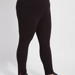 color=Black, side view, plus size denim skinny jean leggings with concealed smoothing waistband for flattering fit