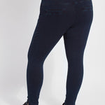 color=Indigo, back view, plus size denim skinny jean leggings with concealed smoothing waistband for flattering fit