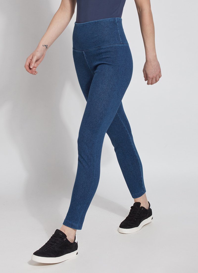 color=Mid Wash, Walking shot of mid wash colored cotton and spandex denim leggings  with concealed signature waistband, from the waist down