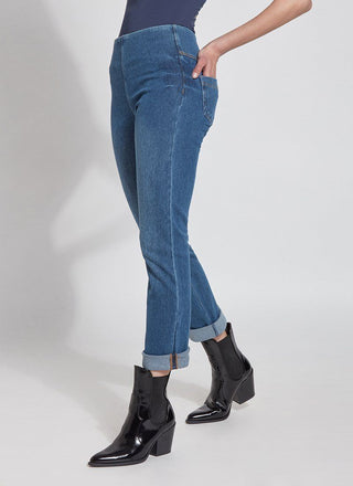 color=Mid Wash, angled front view, plus size boyfriend cut denim leggings with comfort waistband to smooth and slim 
