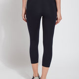 color=Midnight, Rear view of midnight blue flattering cotton crop leggings with concealed waistband for control and comfort