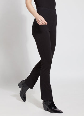 color=Black, Angled side view of black denim straight leg jean leggings with patented concealing waistband